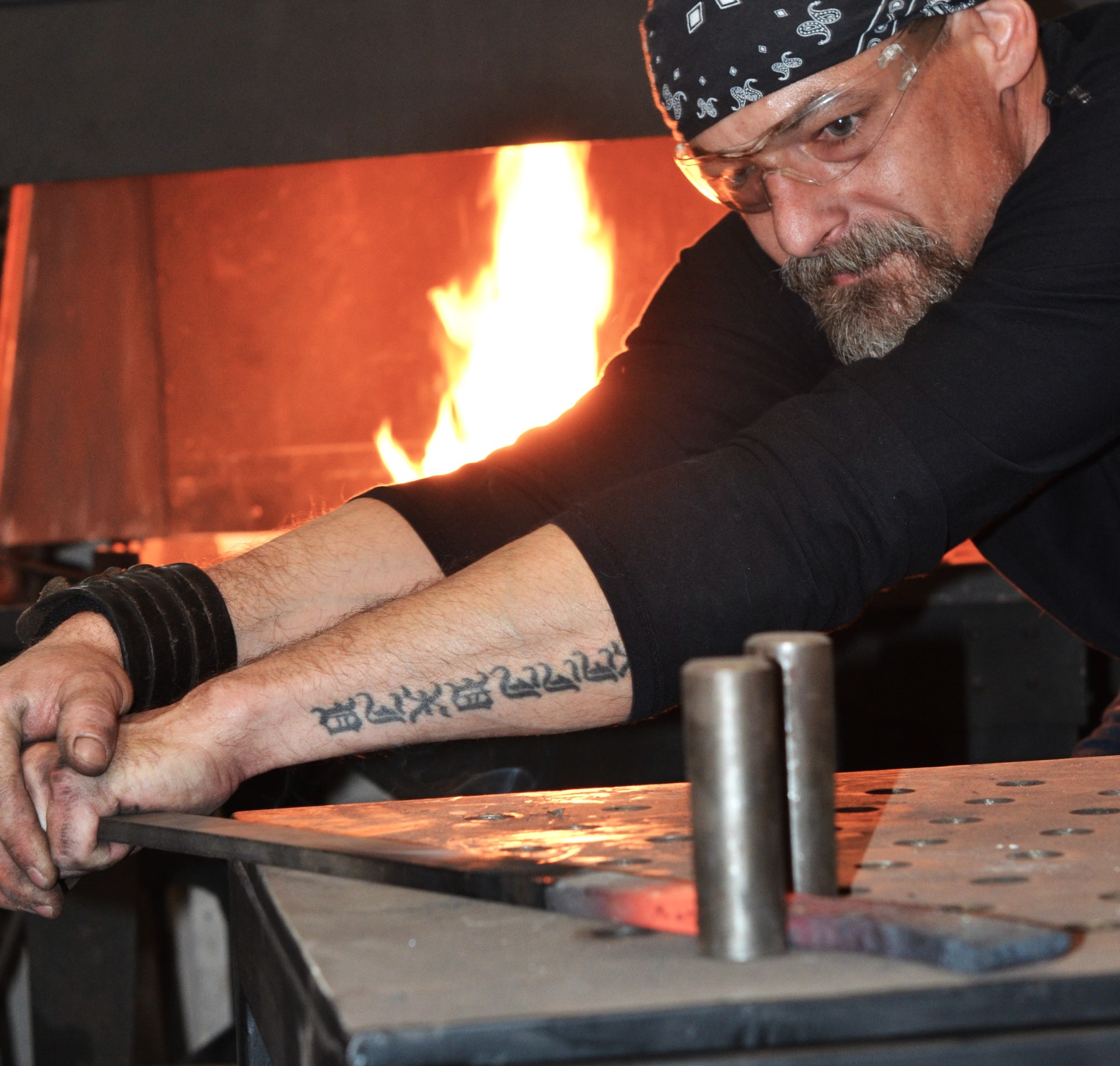 Artistic blacksmith Ladislav Gulyas hand-crafting metal art in his forge. Fine art metalwork, dedication, and the search for the perfect form.