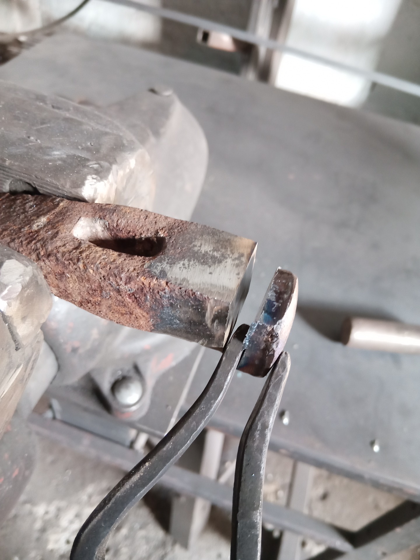 Blacksmith tongs and a piece of an old hammer before welding in the workshop of Ladislav Gulyás.